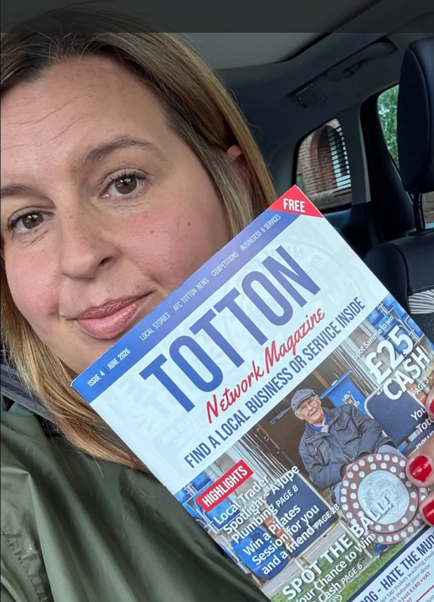 Lisa Ashton, founder of Network Magazines, holding a copy of Totton Network Magazine